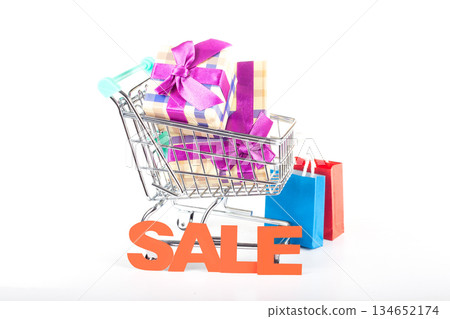 Holiday shopping cart filled with gift boxes and sale packages Holiday shopping cart filled with gift boxes and sale packages 134652174