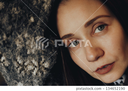 Close-up portrait of a young woman with natural makeup, soft lighting, warm tones. Intimate mood, focus on blue eyes Emotional, artistic female photo Close-up portrait of a young woman with natural makeup, soft lighting, warm tones. Intimate mood, focus on blue eyes Emotional, artistic female photo 134652190