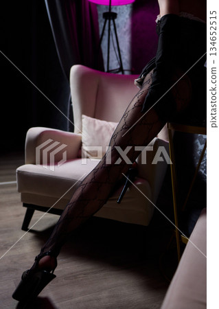 Tranquil evening atmosphere featuring slender figure resting peacefully, Soothing nighttime setting depicting relaxed person with graceful form under soft lighting 134652515