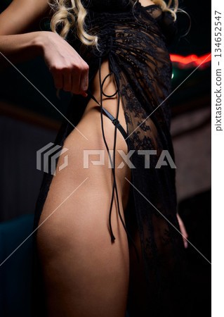 Tranquil evening atmosphere featuring slender figure resting peacefully, Soothing nighttime setting depicting relaxed person with graceful form under soft lighting 134652547