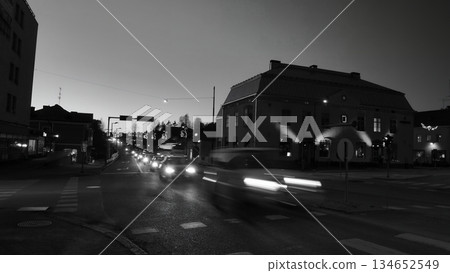 Porvoo, Finland - December 08, 2020: Nighttime city street scene features blurred car lights, showcasing urban life and movement in a bustling environment with buildings Porvoo, Finland - December 08, 2020: Nighttime city street scene features blurred car lights, showcasing urban life and movement in a bustling environment with buildings 134652549