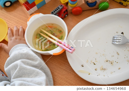 The toddler has played and eaten, so it's about time for him to go to bed. 134654968