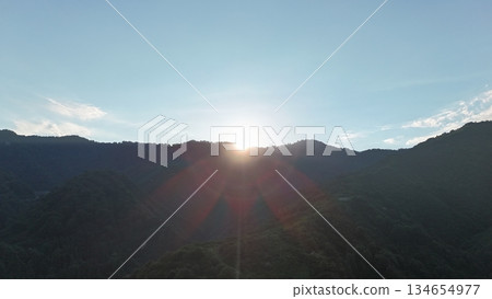 <Aerial> Morning sun shining through the mountains <Aerial> Morning sun shining through the mountains 134654977