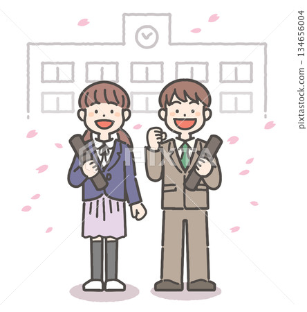 Smiling elementary school boy and girl holding a diploma amid a flurry of cherry blossom petals 134656004