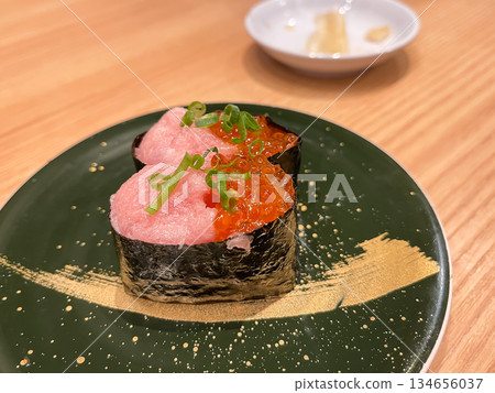 Japanese sushi. Gunkanmaki sushi with tuna, green onion and salmon roe. 134656037