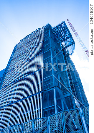 Huge building under construction and crane a-1 134656107