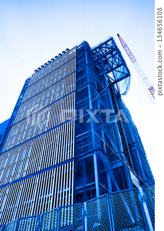 Huge building under construction and crane a-2 High saturation contrast Huge building under construction and crane a-2 High saturation contrast 134656108