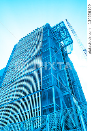 Huge building under construction and crane a-3 light color Huge building under construction and crane a-3 light color 134656109