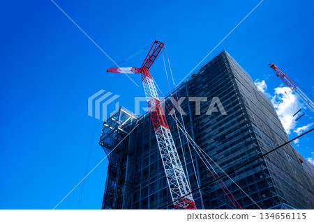 Huge building under construction and crane c-1 134656115
