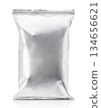 Blank silver foil snack packaging bag mockup isolated on a white background 134656621