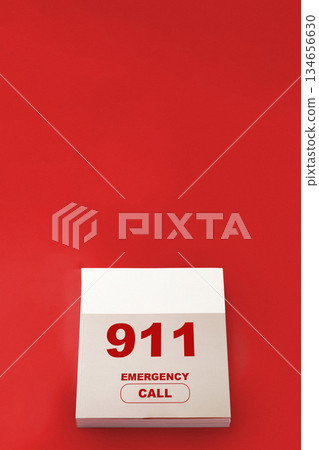 Emergency call calendar marked with 911 on bright red background 134656630