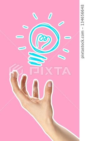 Creative hand reaching for a light bulb idea against a pink background 134656648
