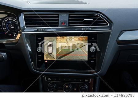Display screen shows parking assist features in a modern vehicle dashboard Display screen shows parking assist features in a modern vehicle dashboard 134656793