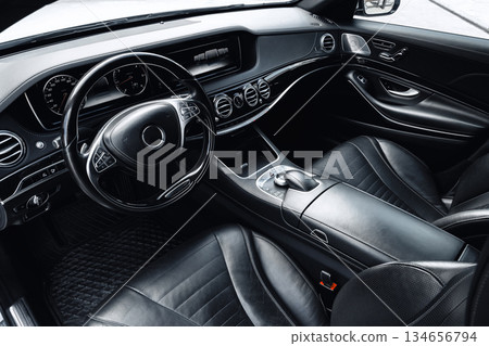 Interior of a luxurious black leather car showing elegant design and modern features Interior of a luxurious black leather car showing elegant design and modern features 134656794