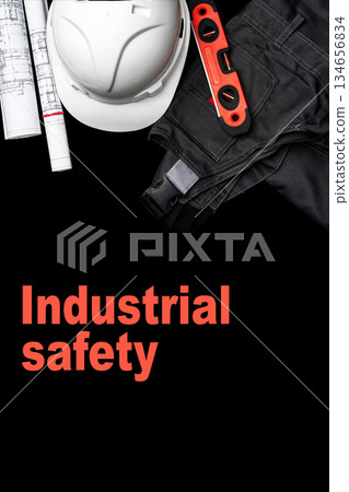 Safety gear and tools for construction work displayed on a black background 134656834