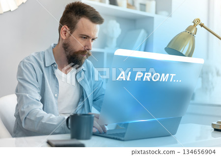 Man working on laptop with focus on AI prompts in a modern workspace Man working on laptop with focus on AI prompts in a modern workspace 134656904