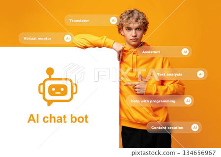 Person in yellow hoodie points to a sign with a chatbot logo and text in front of orange background 134656967