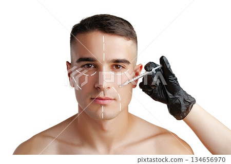 Man receiving cosmetic treatment in a clinical setting with facial markings 134656970