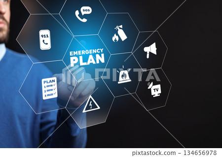 Emergency response plan displayed on a screen by a person in a blue shirt 134656978