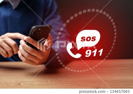 Person calling for help using a mobile phone to reach emergency services Person calling for help using a mobile phone to reach emergency services 134657065
