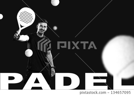 Smiling player enjoys padel game while serving tennis balls indoors 134657095