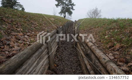 military training terrain, practice area with trenches structures, simulation zone for combat and excavation drills, training ground featuring earthworks and wooden military constructions 134657752