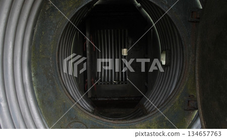 maintenance openings within fuselage leading to engine compartment routes, entry points inside aircraft fuselage facilitating service team inspection of engine ducting and wiring paths 134657763