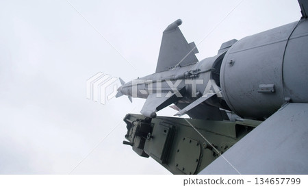 missile setup underway, premission preparations involve technicians assembling underwing missile system, technicians configure and verify missile mounted on pylon before aircraft sortie missile setup underway, premission preparations involve technicians assembling underwing missile system, technicians configure and verify missile mounted on pylon before aircraft sortie 134657799