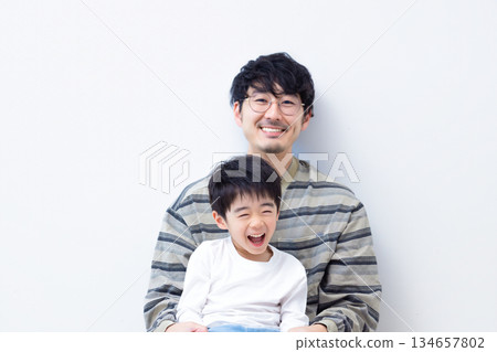 Family portrait of a boy and his father Family portrait of a boy and his father 134657802
