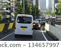 Private car driving on main road during rush hour 134657997
