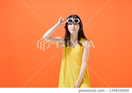 Young woman in sunglasses Young woman in sunglasses 134658090