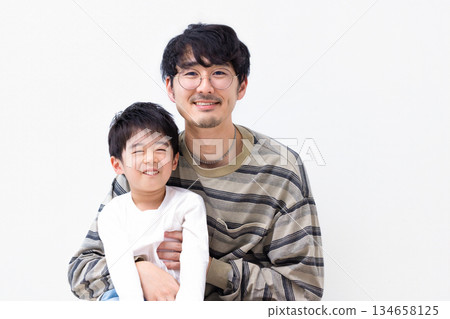 Family portrait of a boy and his father Family portrait of a boy and his father 134658125