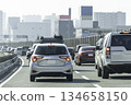 Private cars driving during rush hour on main roads 134658150