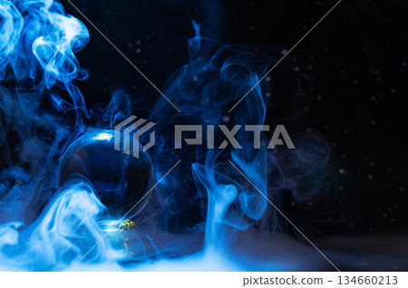 Crystal magical glass ball, mystical smoke and abstract light painting on dark background. Forecasting AI intuition, data flow, future technology. Crystal magical glass ball, mystical smoke and abstract light painting on dark background. Forecasting AI intuition, data flow, future technology. 134660213