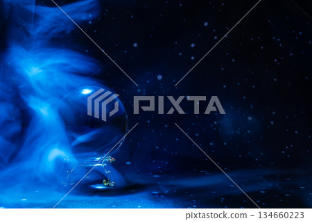 Crystal magical glass ball, mystical smoke and abstract light painting on dark background. Forecasting AI intuition, data flow, future technology. Crystal magical glass ball, mystical smoke and abstract light painting on dark background. Forecasting AI intuition, data flow, future technology. 134660223