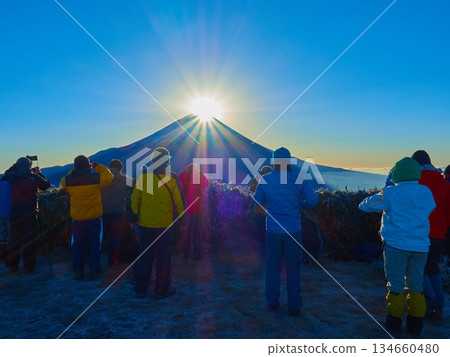 Climbers viewing Diamond Fuji from the summit of Mount Ryugatake on a winter morning in Fujikawaguchiko Town, Yamanashi Prefecture 134660480