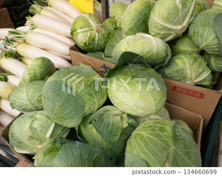 Cabbages lined up in a store 134660699