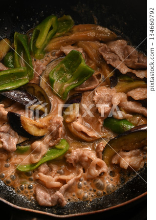 Stir-fried eggplant, green pepper, and pork with miso while cooking 134660792