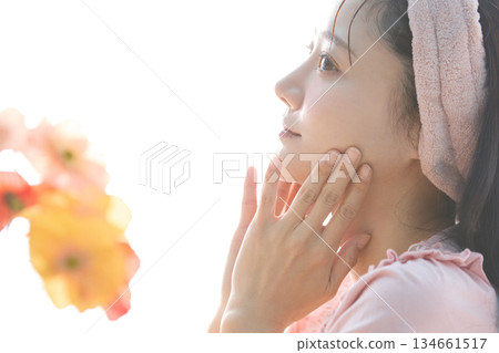 Beauty portrait of a young woman posing by the window Beauty portrait of a young woman posing by the window 134661517