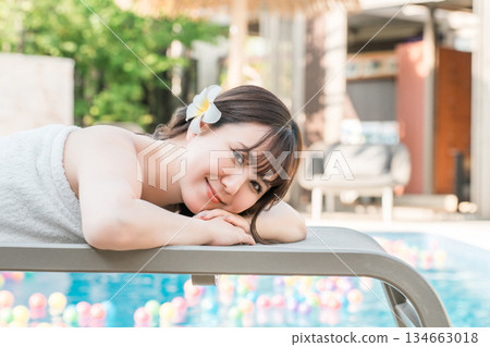 A woman receiving a massage at a tropical spa, beauty salon, or esthetic salon A woman receiving a massage at a tropical spa, beauty salon, or esthetic salon 134663018