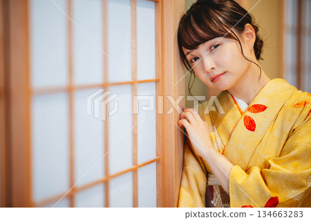 A young and beautiful kimono woman in a Japanese-style room A young and beautiful kimono woman in a Japanese-style room 134663283