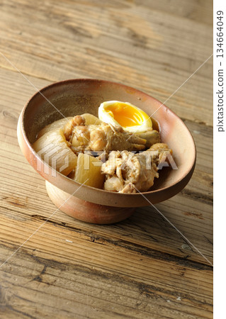 Sweet and spicy stewed chicken wings, radish and eggs Sweet and spicy stewed chicken wings, radish and eggs 134664049