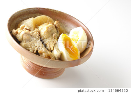 Chicken wings, radish, and egg stewed in sweet and spicy sauce photographed on a white background Chicken wings, radish, and egg stewed in sweet and spicy sauce photographed on a white background 134664330