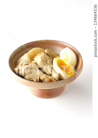 Chicken wings, radish, and egg stewed in sweet and spicy sauce photographed on a white background Chicken wings, radish, and egg stewed in sweet and spicy sauce photographed on a white background 134664336