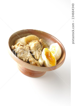 Chicken wings, radish, and egg stewed in sweet and spicy sauce photographed on a white background Chicken wings, radish, and egg stewed in sweet and spicy sauce photographed on a white background 134664340