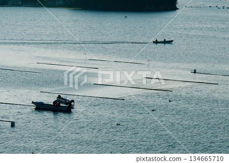 A small fishing boat heading out to sea A small fishing boat heading out to sea 134665710