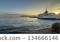 A ferry arriving at dawn 134666146