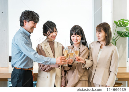 Men and women businessmen toasting with champagne (teamwork, rally, victory party, celebration) Men and women businessmen toasting with champagne (teamwork, rally, victory party, celebration) 134666689