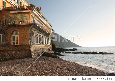 Stone building, construction on the seashore. Traditional Italian architecture. Nature on a sunny day. Background for design. Stone building, construction on the seashore. Traditional Italian architecture. Nature on a sunny day. Background for design. 134667154