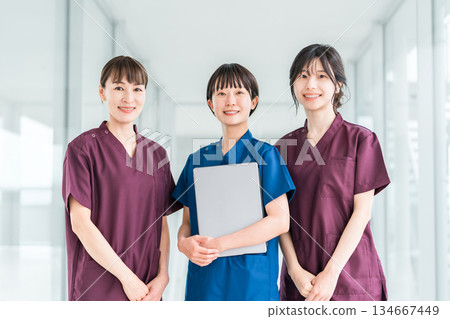 Female staff of doctors, physicians, nurses, medical professionals, doctors, occupational therapists and physical therapists wearing scrubs 134667449